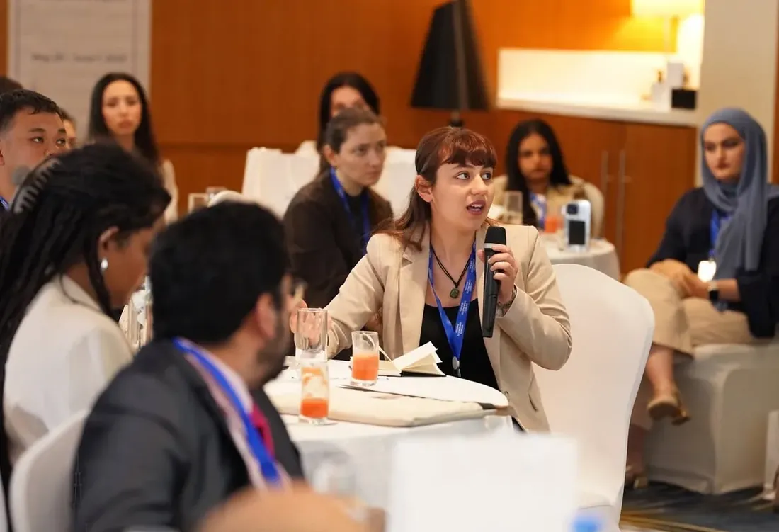 A delegate speaking during a forum session
